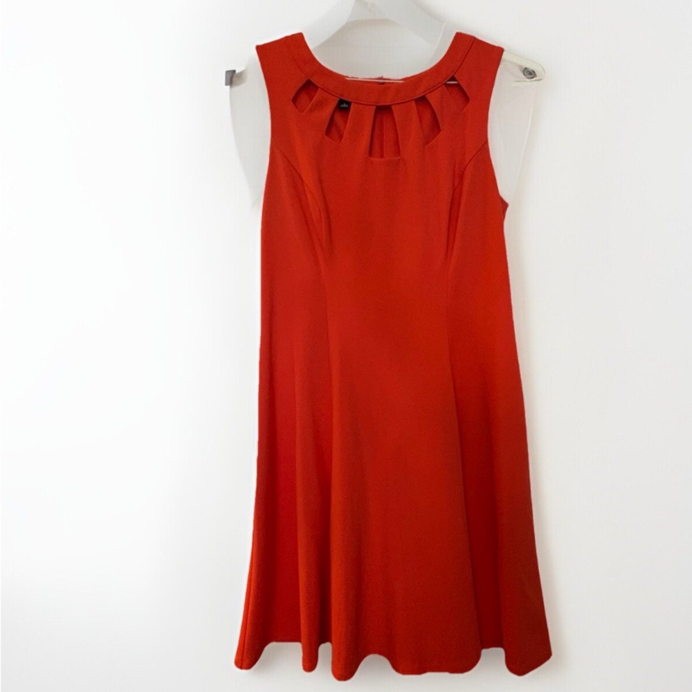 Coral/orange Roz & Ali A-Line dress with cut out design. Hidden zipper